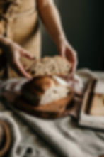 hands holding bread sourdough gluten free
