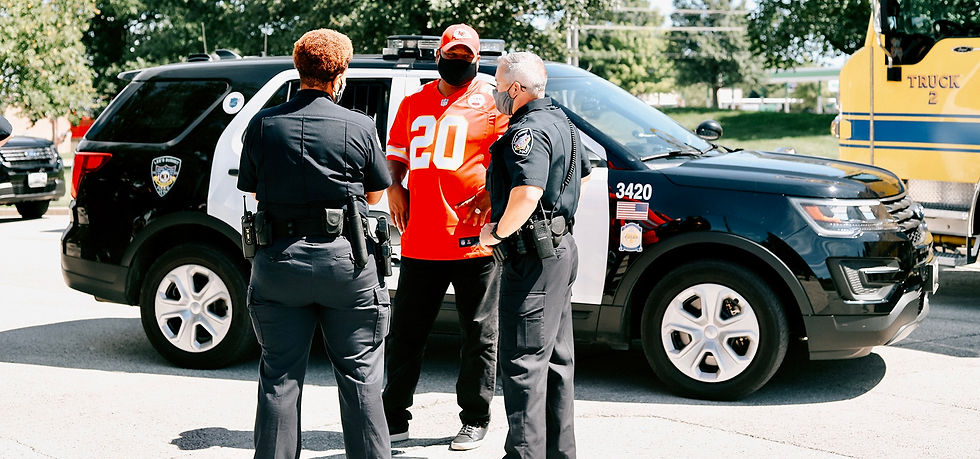 Deron talking with officers during a Answering the Call meetup