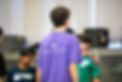 Back of an individual's shirt, reading "Mandarins Leadership Camp. Passion. Confidence. Impact."