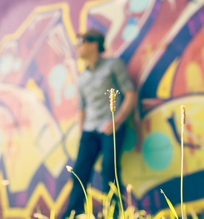 Man on a graffiti wall