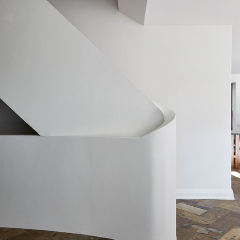 Transform your outdated stairway into this custom plaster desgin
