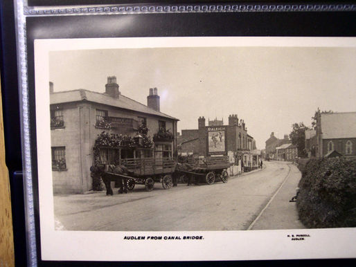 Bridge Inn With 2 Horse Drawn Wagons Outside