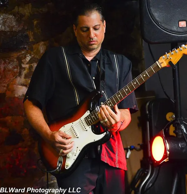 Man playing electric guitar at a performance Honest Lee Soul- Presented by New Haven Lounge Series