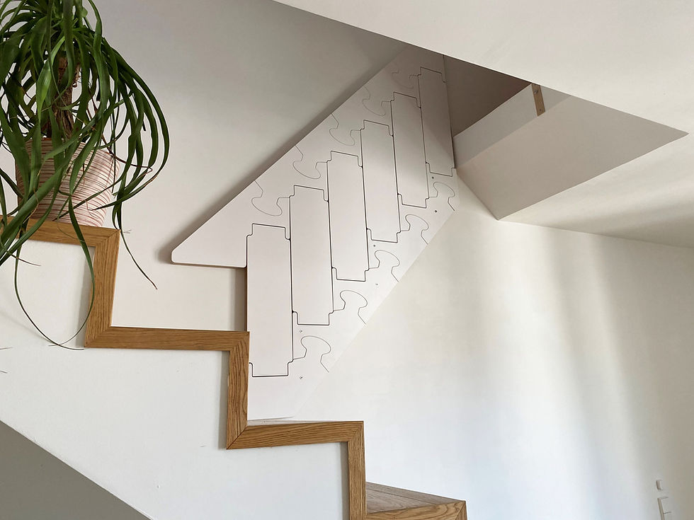 A folding staircase is installed on top of an existing staircase, to give access to a small storage space