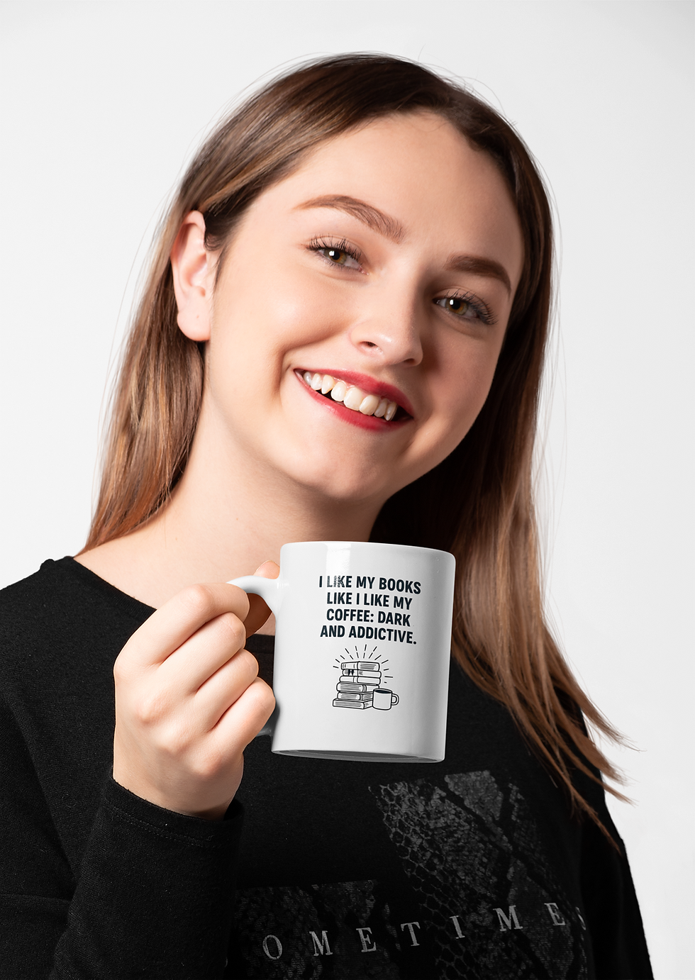 Smiling woman holding a white ceramic coffee mug with the text “I like my books like I like my coffee: dark and addictive.”