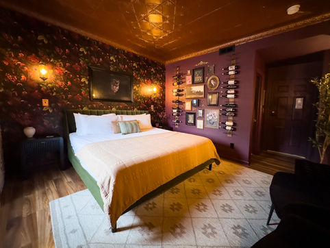 Olive Green Velvet King Bed in Wine-Themed Room – Room 9, Hotel Lanesboro