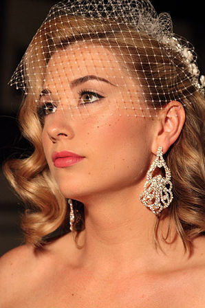 Vintage style hairstyle with the birdcage and  the modern radiant makeup done on site in NYC.