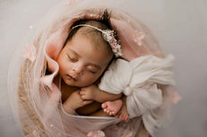 baby girl in pink at newborn photoshoot in Chicago Illinois