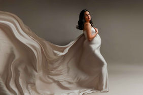 mom awaiting for her baby to arrive in all her maternity glow for photos at studio in Montgomery Illinois