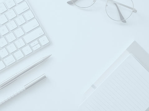 desk with laptop and pen