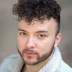 A close up headshot of a man