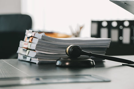 business-lawyers-discussing-contract-papers-with-brass-scale-desk-office-law-legal-service