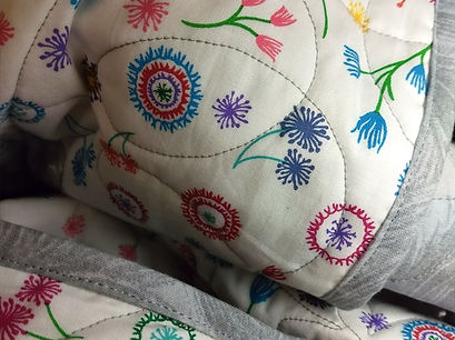 Apple Basket Quilting longarmed this quilt and then provided the machine quilt binding service