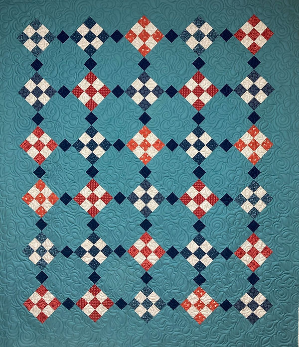 Nine Patch Fun Floral Feathers longarm quilter Apple Basket Quilting.jpg