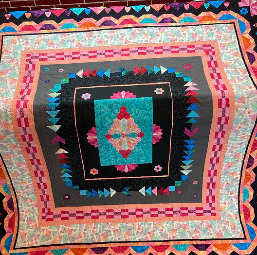 very colorful medallion quilt.JPEG