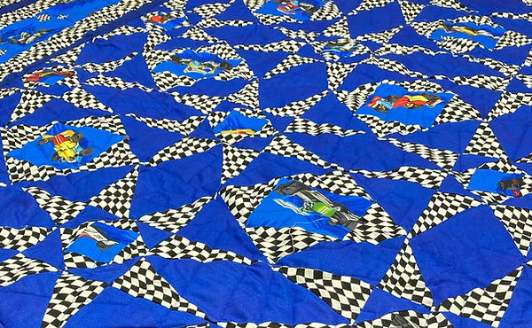 Racecar quilt longarm quilting by Apple Basket Quilting.jpg