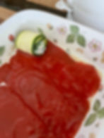 Place zucchini rollup on sauce