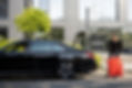 chauffeur-packs-a-suitcase-into-luxury-car-2023-11-27-05-19-12-utc.JPG