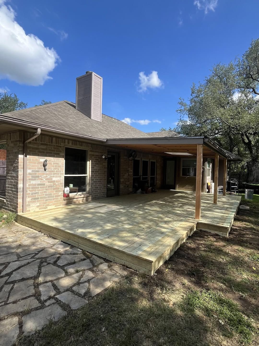 New wooden deck and landscaping in an Austin backyard