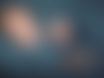 smiling baby wrapped in swaddling clothes