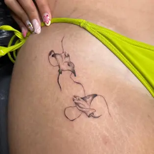 Delicate fine line stingray tattoo on hip done at GG Tattoo Budva, a professional studio offering custom tattoo in Budva Montenegro.
