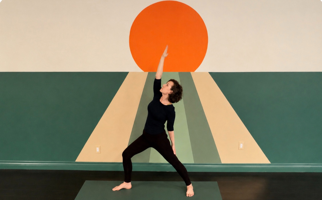 Soft yoga bolsters and blankets prepared for a restorative yin yoga class in a tranquil environment