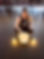 Woman playing sound bowl during yoga class