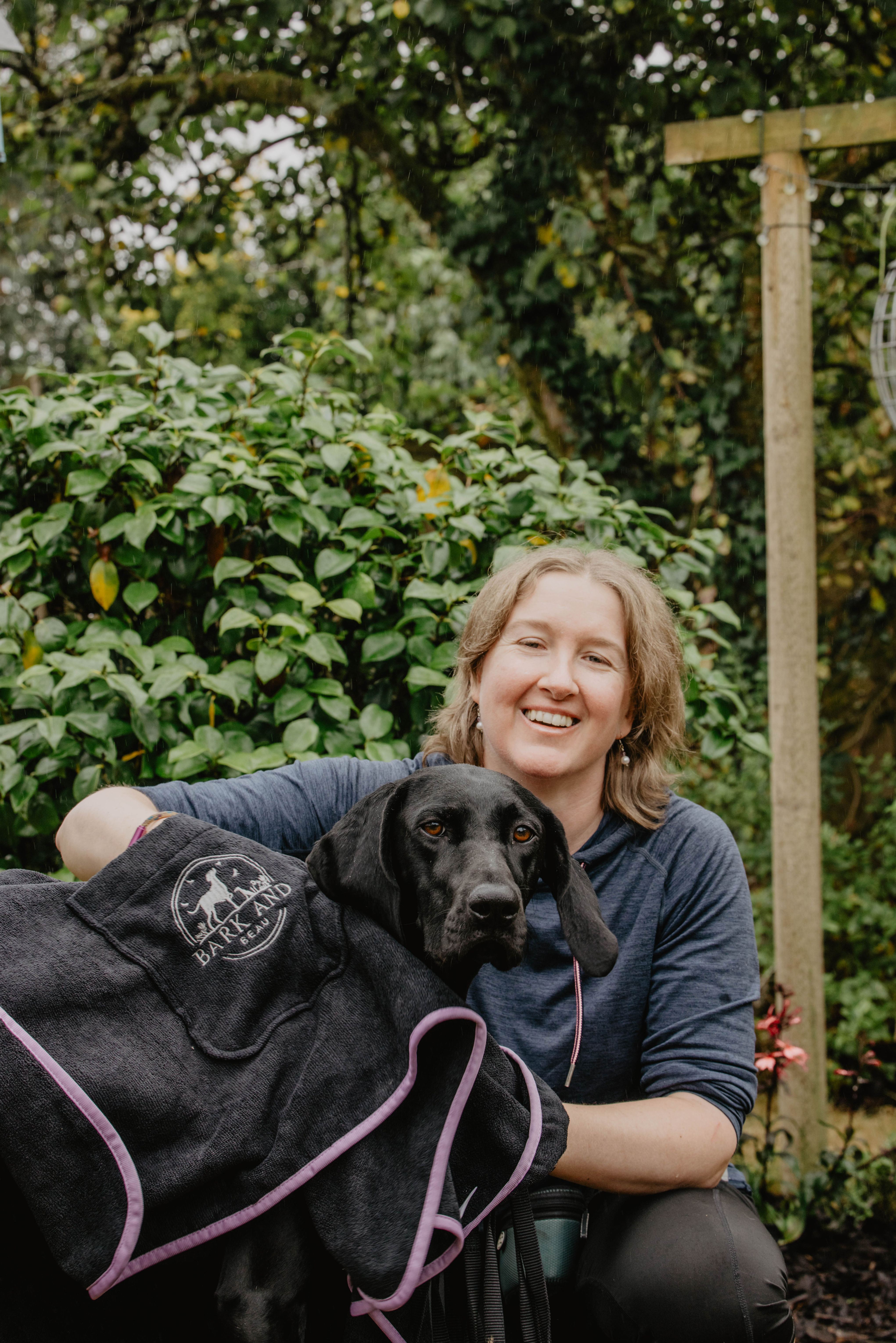 Black dog being dried by Bark and Beau XL Drying Towel Kit