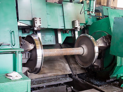 Rail wheelset in a lathe Repair shop of railway cars.jpg