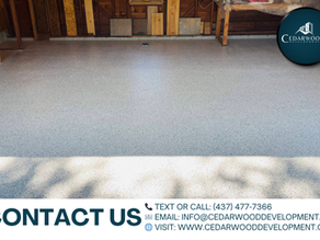 Smooth gray epoxy garage floor installed by Cedarwood Development Group Inc. in Toronto – contact us for professional epoxy flooring services in the GTA