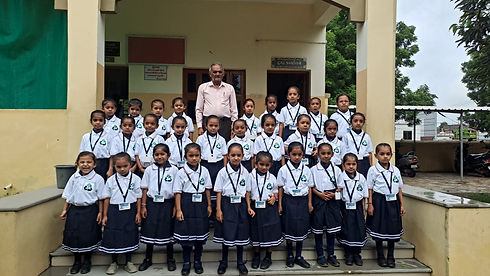 School Teacher with Students.jpeg