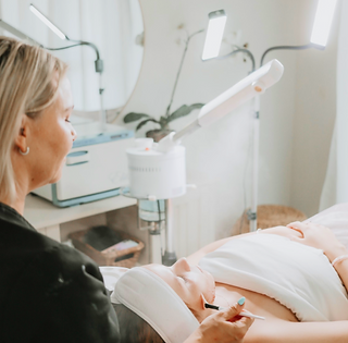 Rebeca Price, PA‑C with VELO Med Spa team in the Bonita Springs clinic.