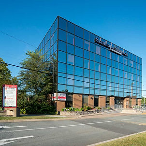 large building full of windows on the roadside