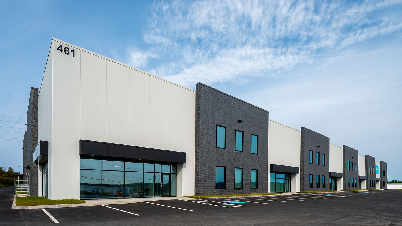 white and black building with 4 units
