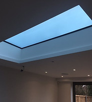 flat-aluminium-roof-light-lantern-ceiling-evening.jpg