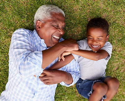 Grandfather and boy smiling