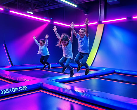 more kids jumping on a indoor trampoline with neon lights.jpg