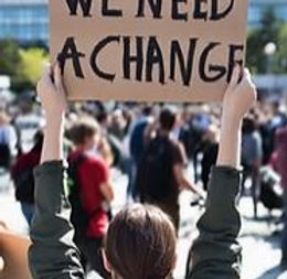 WG We need a change Sign.JPG