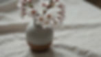 Cherry blossoms in a ceramic vase at a wellness studio