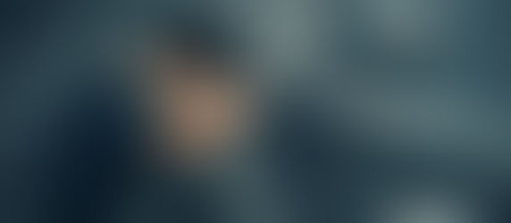 Digital illustration of a depressed young man curled up on a bathroom floor beside drugs, pills and a cracked mirror, representing mental illness, addiction, dissociation, and emotional distress.