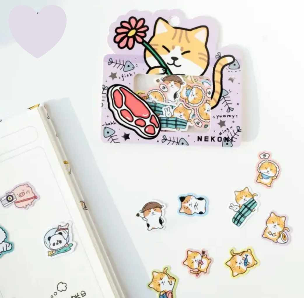 nekoni cat stickers, spread out on a table