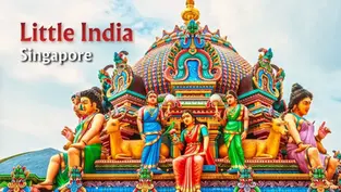 Colorful Hindu temple facade with detailed statues of deities and animals under a blue sky. Text reads "Little India, Singapore."