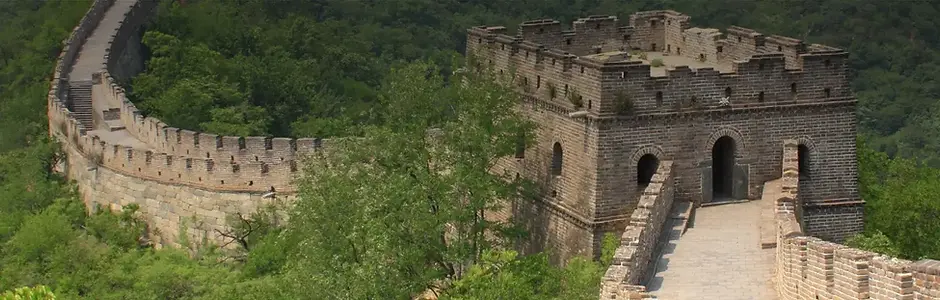 The Great Wall of China winding along misty mountain ridges in Beijing.