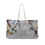 Thumbnail: A large tote bag with a marbled pattern reminiscent of Mexican Tile Art, featuring white double rope handles.