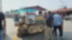 People gather around a street food cart labeled "Shahi Qila" and "Takeaway Memories From Attari Border," with colorful umbrellas and bottles.