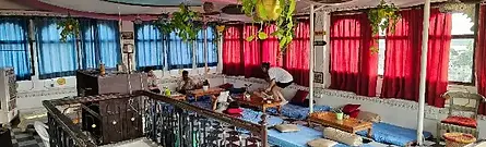 The comfortable rooftop lounge area with scenic views at Dreamyard Hostel in Udaipur, India.