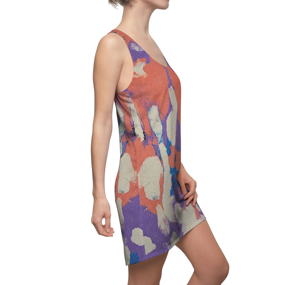 A person wearing a vibrant Cotton Candy Multicolor Racerback Dress, featuring an abstract mix of orange, purple, and cream.