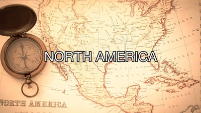 A vintage map of North America with a compass on the left. Large text across the center reads "NORTH AMERICA."