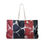 Thumbnail: A large tote bag featuring a red and black marbled pattern reminiscent of tile patterns, accented by elegant white veins.