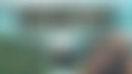 A smiling man and woman pose outdoors next to a large water feature. Text overlay reads "15 Top Travel Apps & Websites." Closer Lives logo is in a black circle at the bottom left.